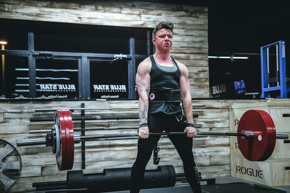 Strength athlete lifting a loaded barbell