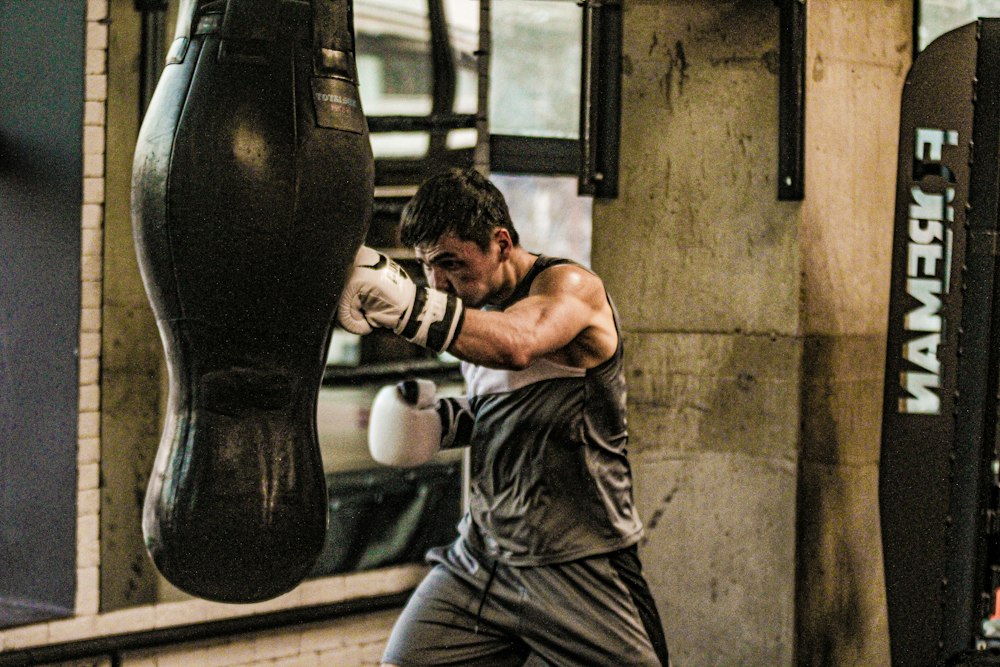 Athlete practising boxing combinations on a heavy bag