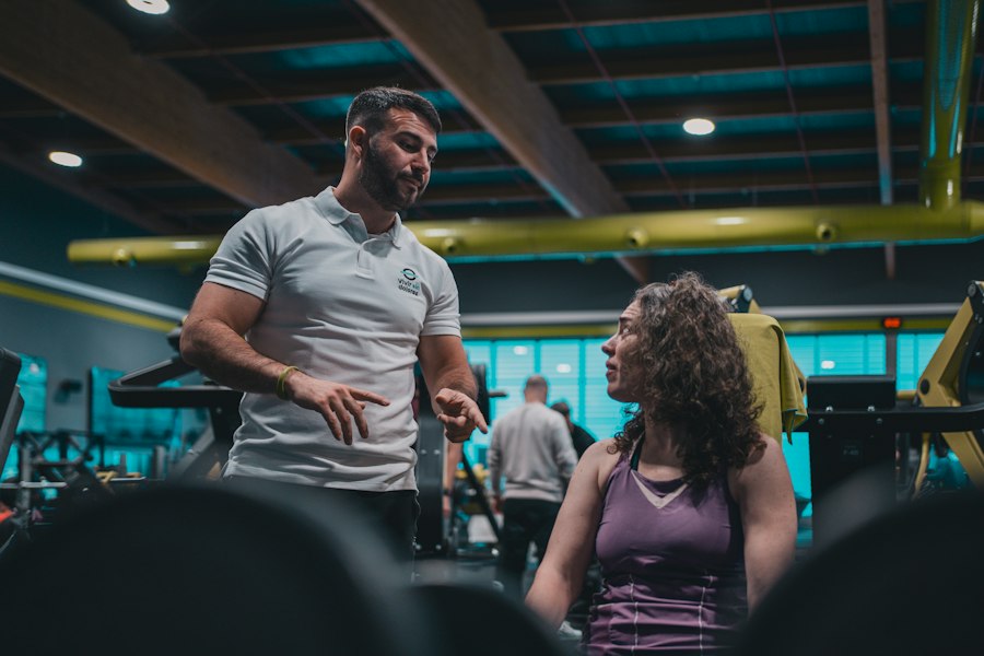 Coach explaining a training plan to a member