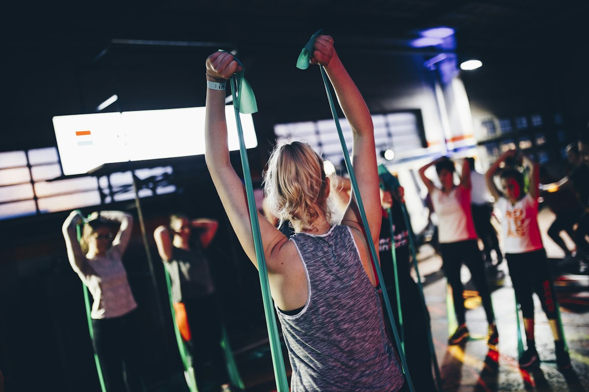 Gym members training together in a group strength class