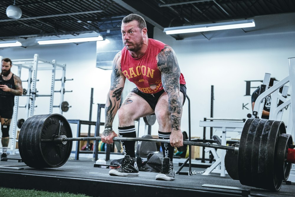 Lifter preparing to pull a loaded barbell