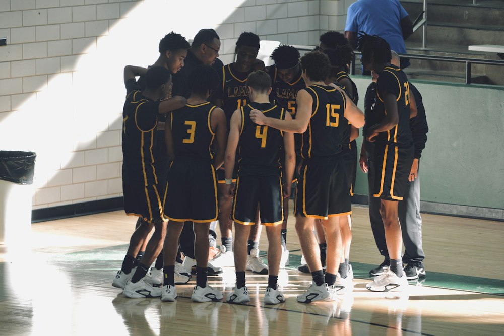 Youth basketball team gathered on court