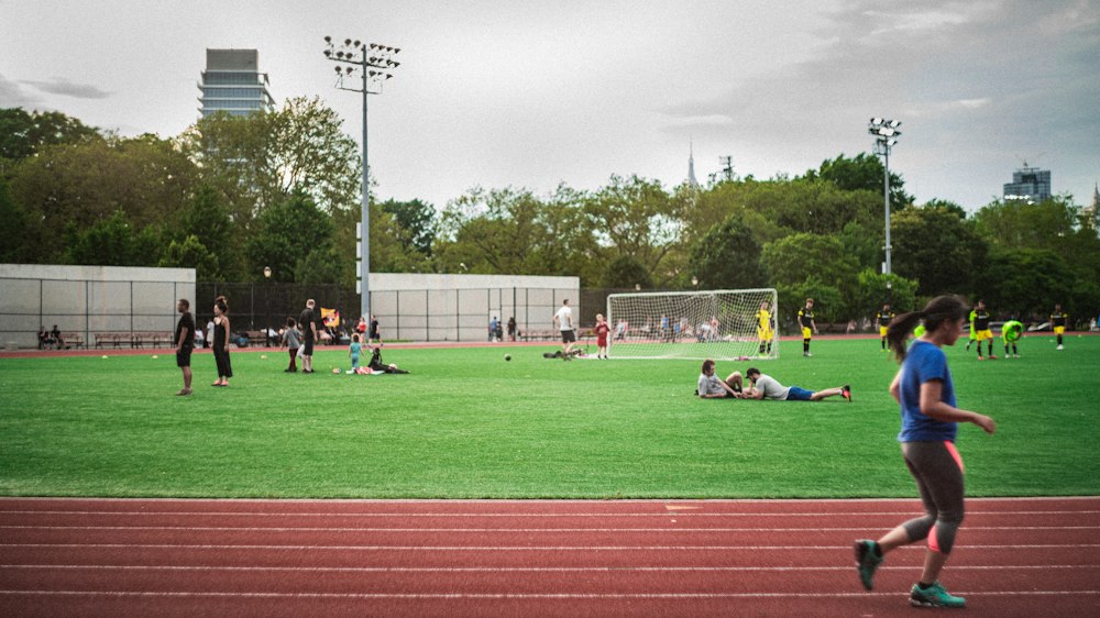 Young football player accelerating across a pitch